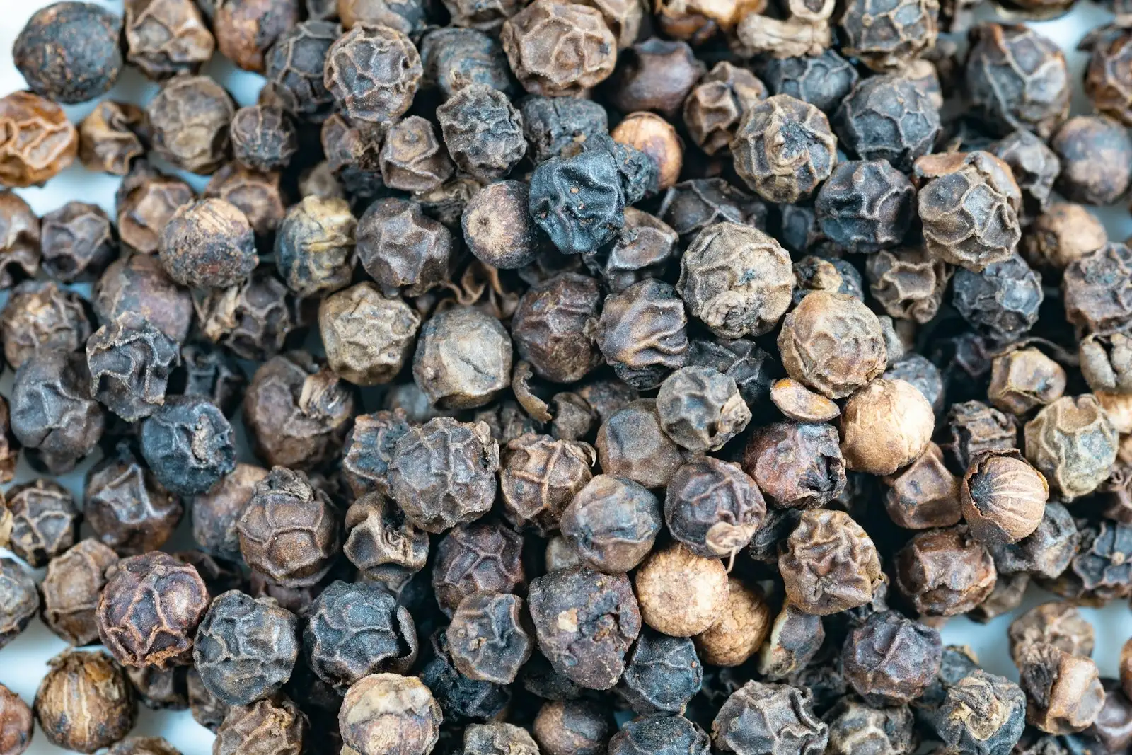 Close-up of black peppercorns, the best-known dietary source of beta-caryophyllene