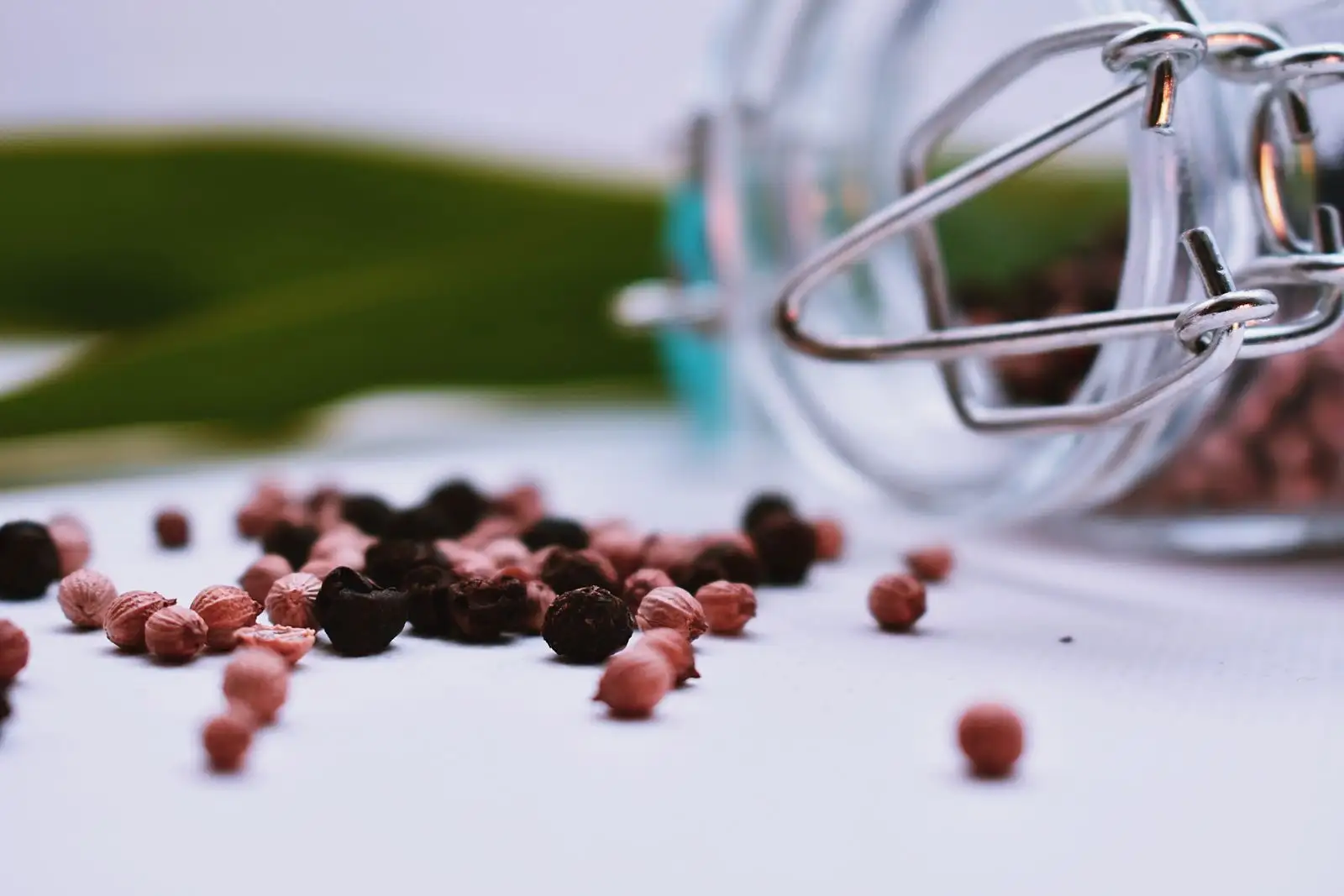 Close-up of black and pink peppercorns, a spice rich in beta-caryophyllene