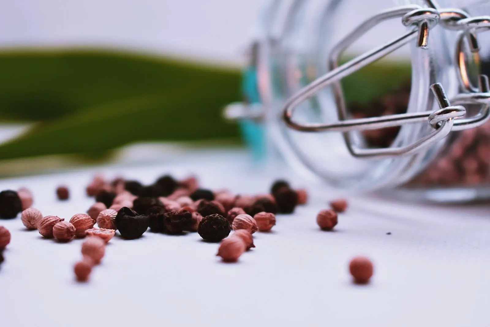 Close-up of black and pink peppercorns, a spice rich in beta-caryophyllene
