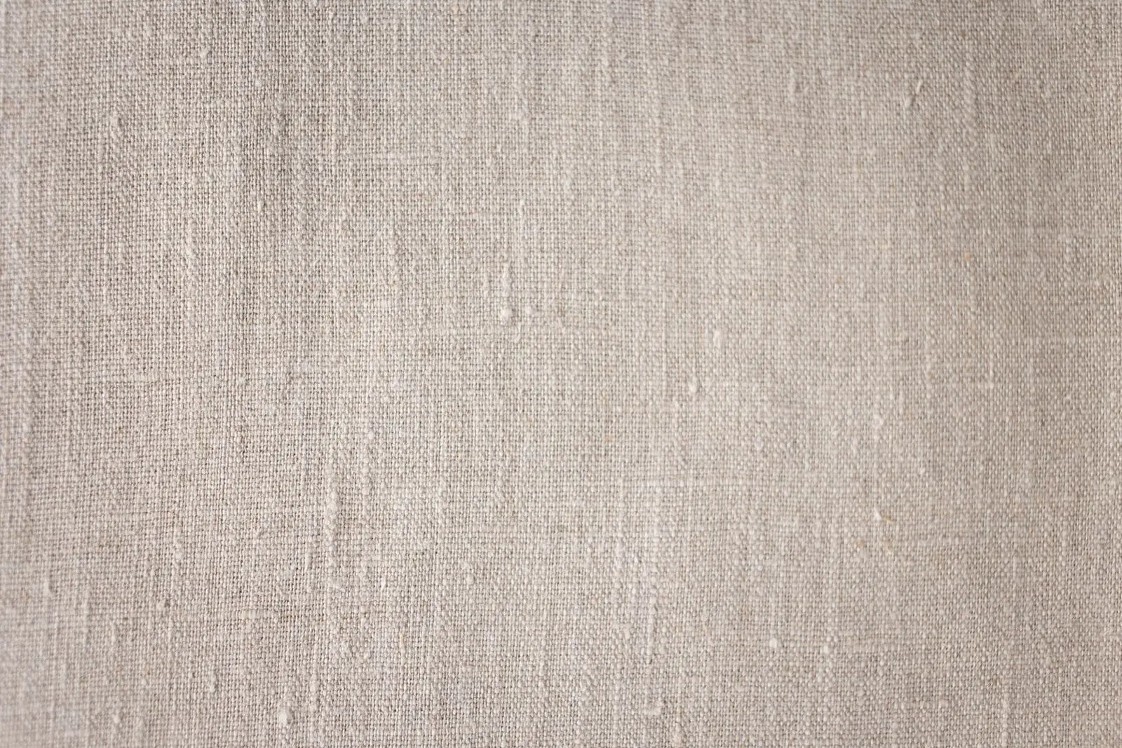 Close-up of an undyed plant-fibre fabric: by eye, nothing tells hemp apart from linen