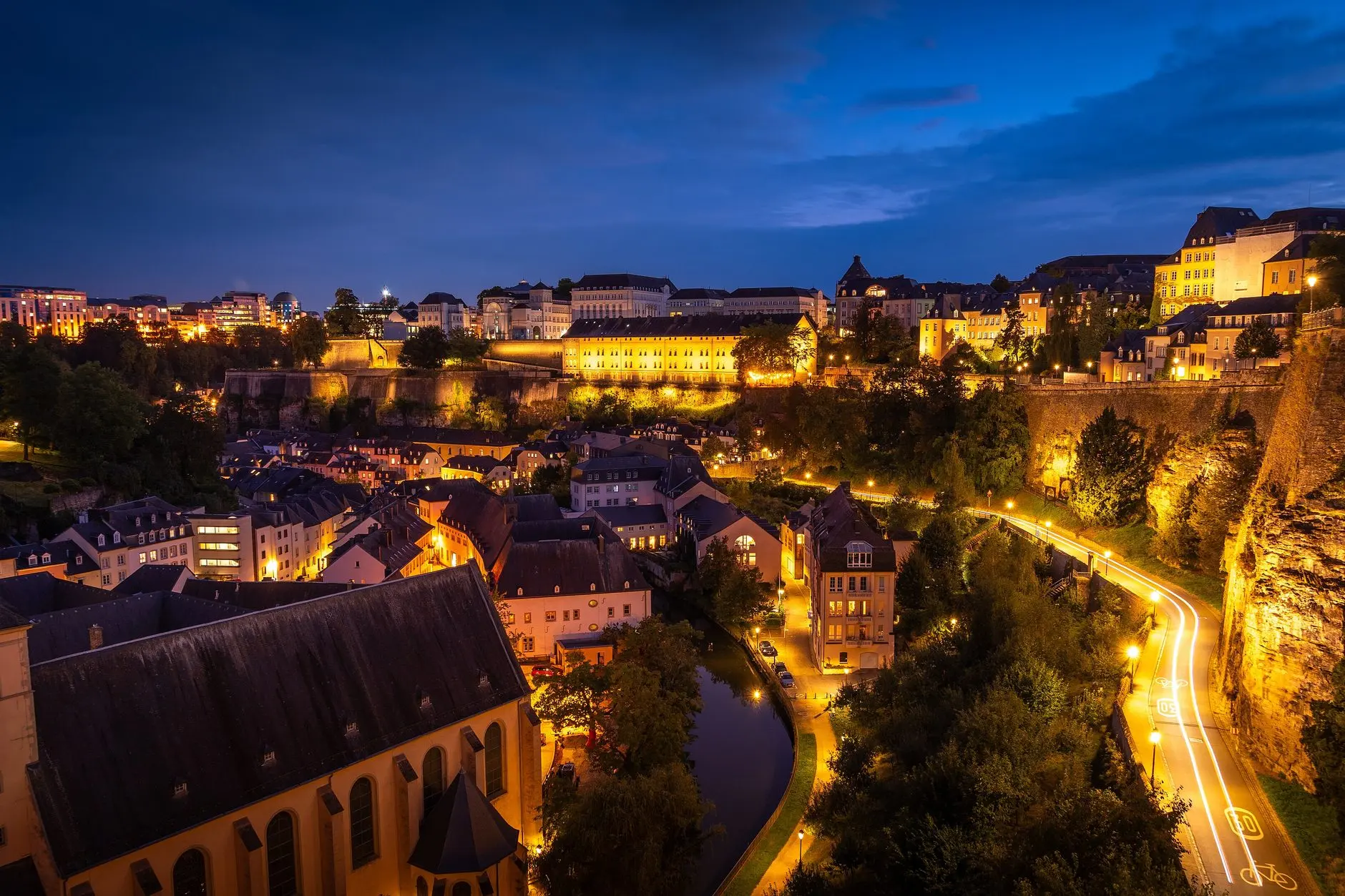 The Grund district of Luxembourg City, lit up at nightfall.
