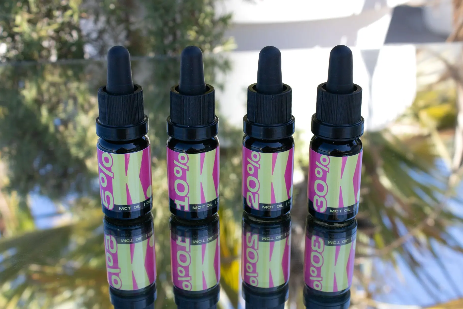 Dropper bottles with colourful labels illustrate CBD packaging without depicting a specific product recall.